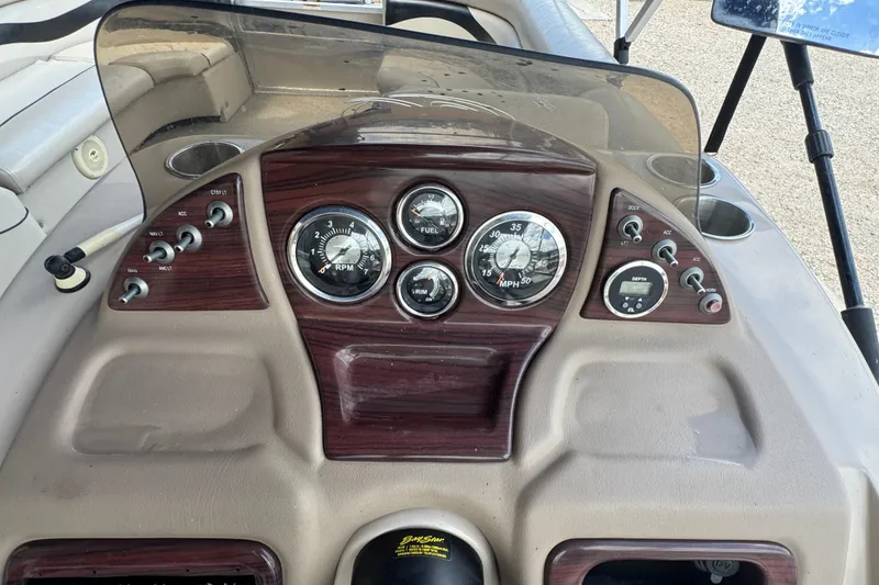 Slide: The Image of Dashboard of a 2011 Veranda Tritoon boat with gauges and controls. - 9