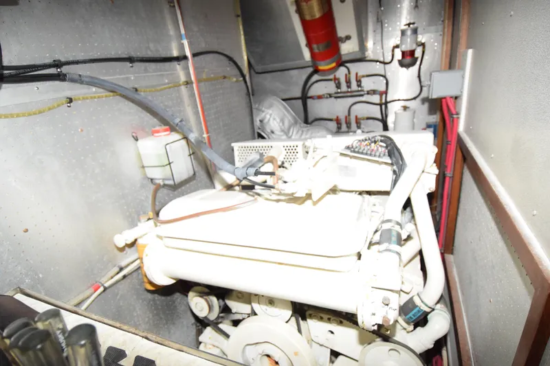 Slide: The Image of Engine room of 1988 Sea Ranger 51 Motor Yacht with visible machinery and wiring. - 10