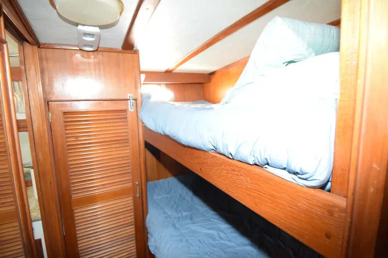 Slide: The Image of Bunk beds in 1988 Sea Ranger 51 Motor Yacht cabin with wooden interior. - 11