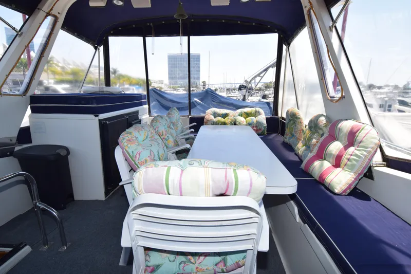Slide: The Image of Interior of 1988 Sea Ranger 51 Motor Yacht with colorful seating and table. - 15