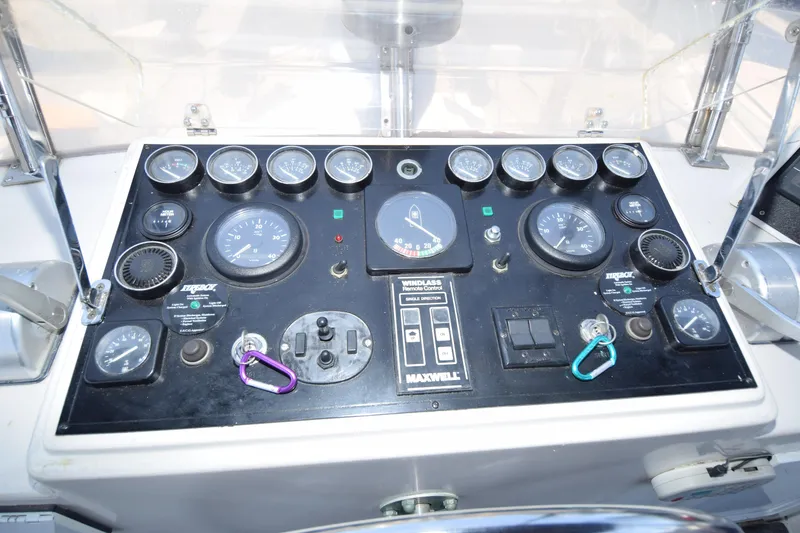 Slide: The Image of Control panel of a 1988 Sea Ranger 51 Motor Yacht with gauges and switches. - 17