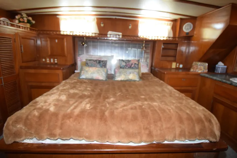 Slide: The Image of Luxurious bedroom interior of 1988 Sea Ranger 51 Motor Yacht with plush bedding. - 4