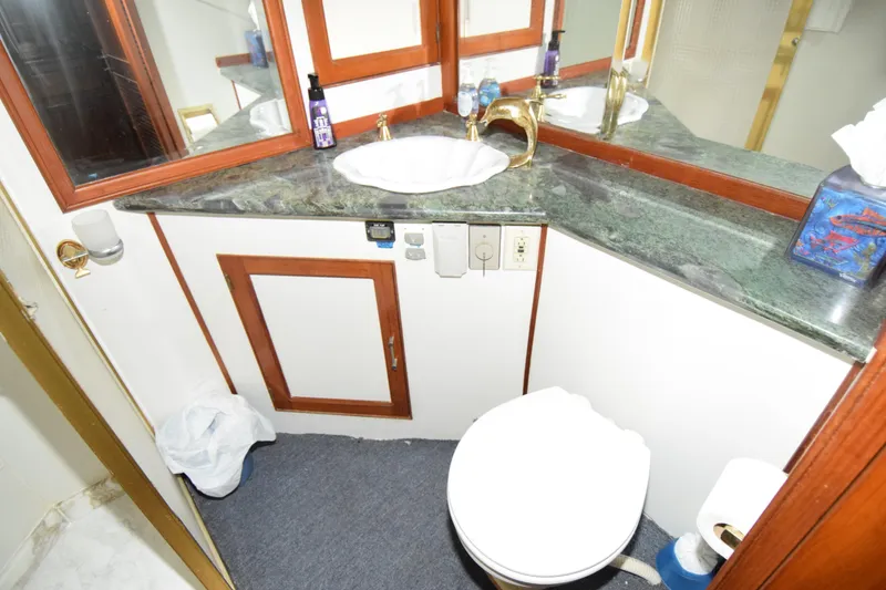 Slide: The Image of Bathroom interior of 1988 Sea Ranger 51 Motor Yacht with sink and toilet. - 6