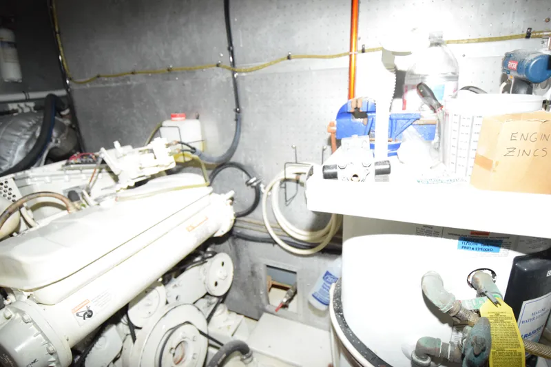 Slide: The Image of Engine room of 1988 Sea Ranger 51 Motor Yacht with visible components and equipment. - 9