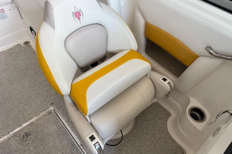 Slide: The Image of 2009 Chaparral Sunesta 244 Xtreme boat seat with yellow and white upholstery. - 10