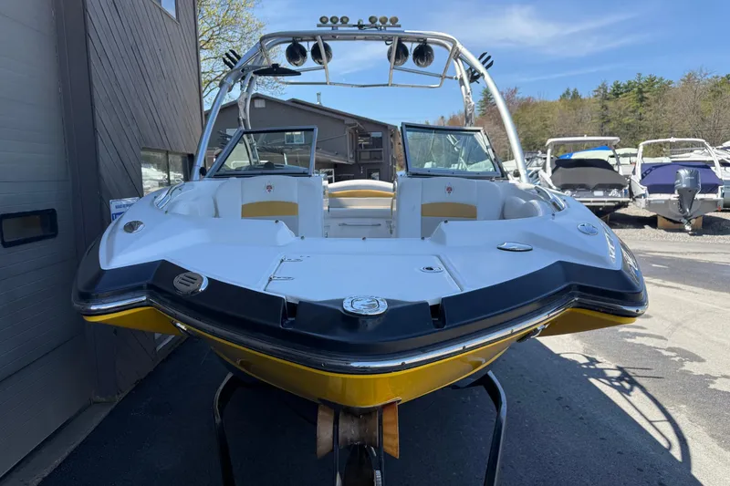 Slide: The Image of 2009 Chaparral Sunesta 244 Xtreme boat with sleek design, docked outdoors. - 12