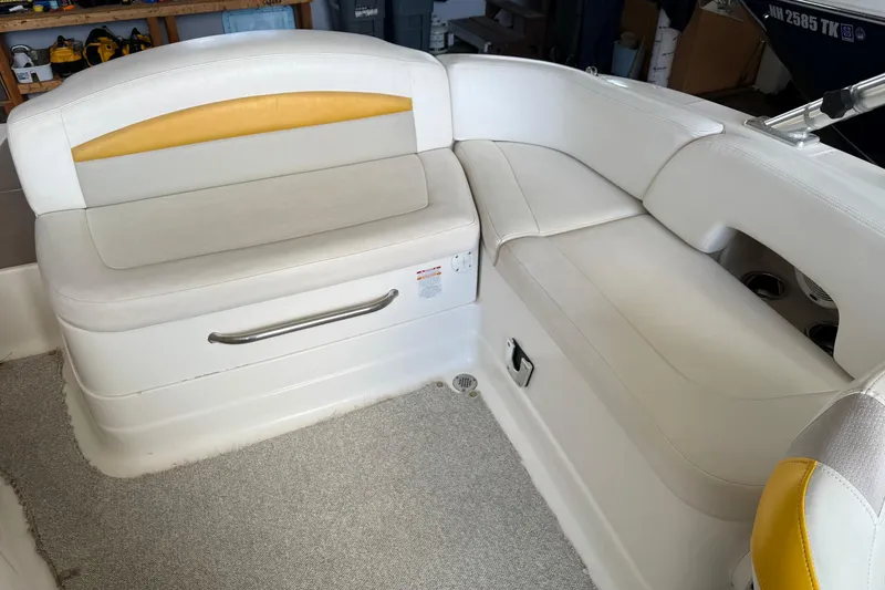 Slide: The Image of 2009 Chaparral Sunesta 244 Xtreme boat interior with white and yellow seating. - 15