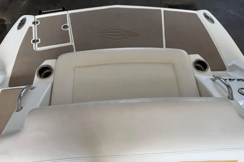 Slide: The Image of 2009 Chaparral Sunesta 244 Xtreme boat interior with seating and cup holders. - 17