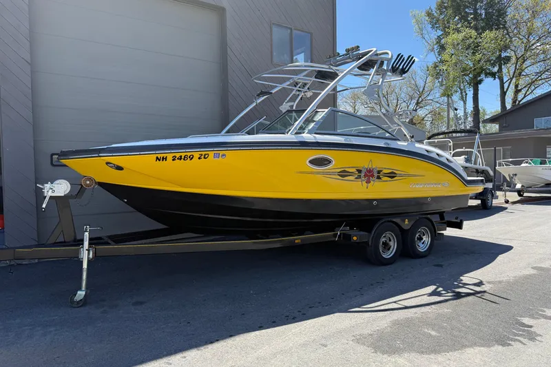 Slide: The Image of 2009 Chaparral Sunesta 244 Xtreme boat in vibrant yellow on a trailer. - 18