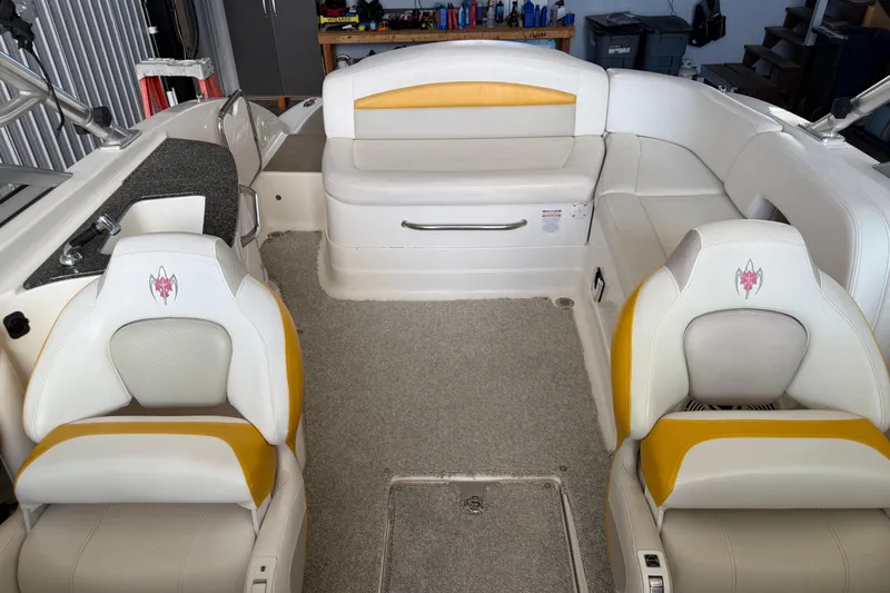 Slide: The Image of 2009 Chaparral Sunesta 244 Xtreme boat interior with white and yellow seating. - 9