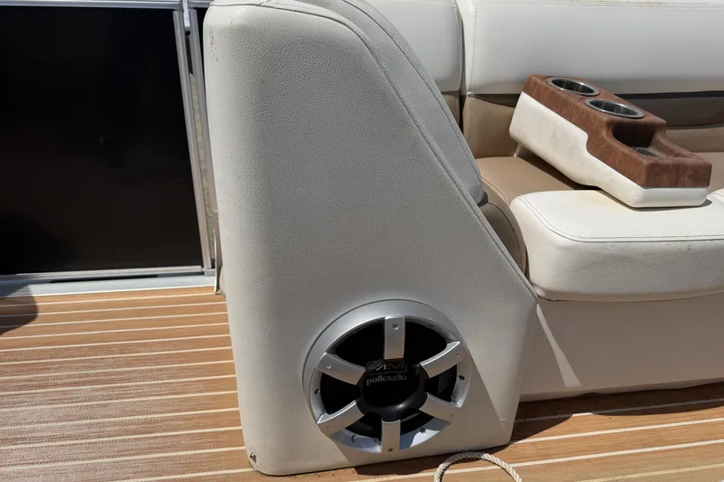 Slide: The Image of 2014 Cypress Cay Cozumel 240 boat interior with Polk Audio speaker and cup holder. - 12
