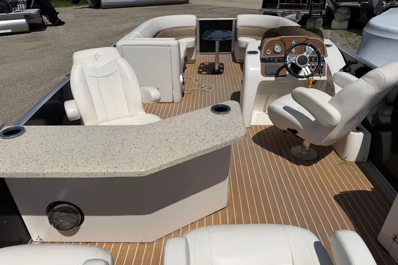 Slide: The Image of 2014 Cypress Cay Cozumel 240 boat interior with plush seating and modern helm. - 22