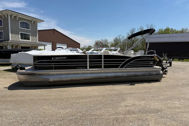 Slide: The Image of 2014 Cypress Cay Cozumel 240 pontoon boat parked outdoors on a sunny day. - 4