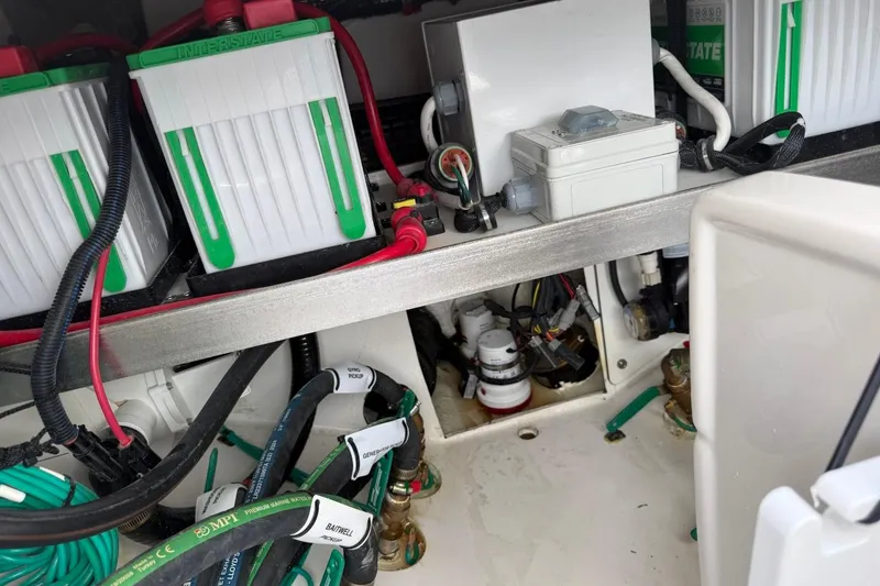 Slide: The Image of Electrical components and wiring inside a 2026 Pursuit S 358 Sport boat. - 17
