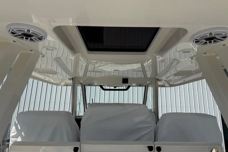 Slide: The Image of Interior view of 2026 Pursuit S 358 Sport boat with covered seats and speakers. - 19