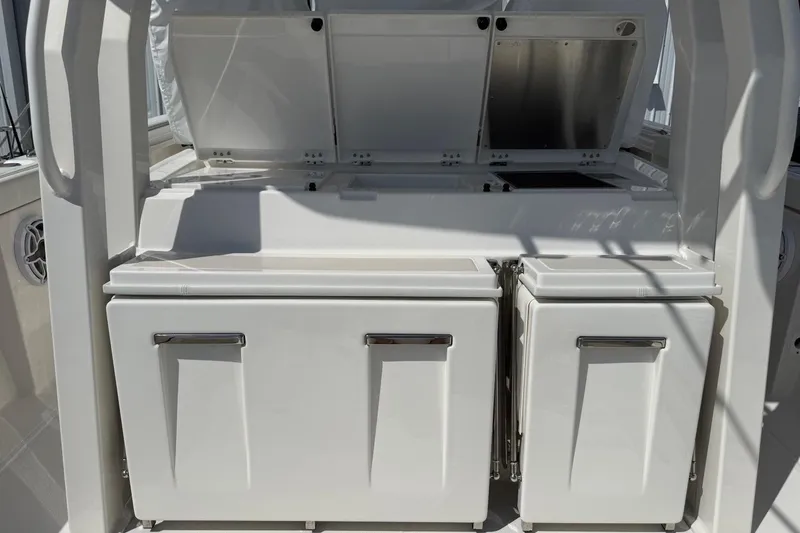Slide: The Image of 2026 Pursuit S 358 Sport boat interior with storage compartments and sleek design. - 20