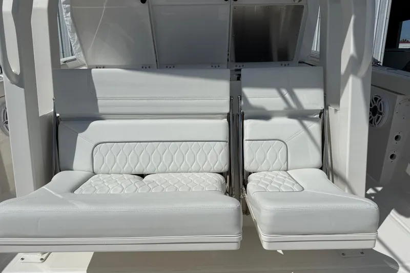 Slide: The Image of Luxurious white seating on the 2026 Pursuit S 358 Sport boat, featuring quilted upholstery. - 22