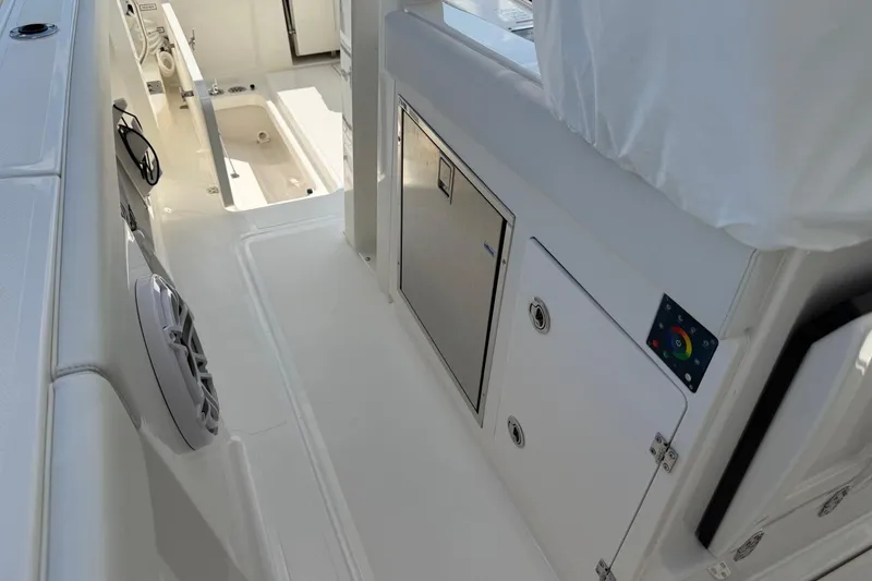 Slide: The Image of 2026 Pursuit S 358 Sport boat interior with sleek white design and modern amenities. - 25