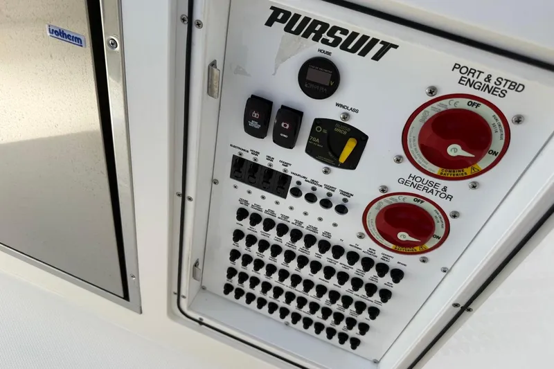 Slide: The Image of Control panel of 2026 Pursuit S 358 Sport boat with switches and dials. - 26