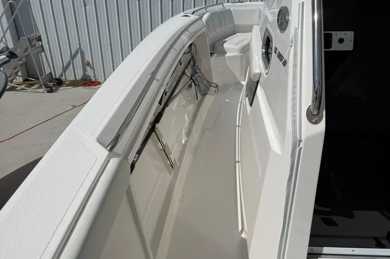 Slide: The Image of 2026 Pursuit S 358 Sport boat interior with sleek white design and modern features. - 29