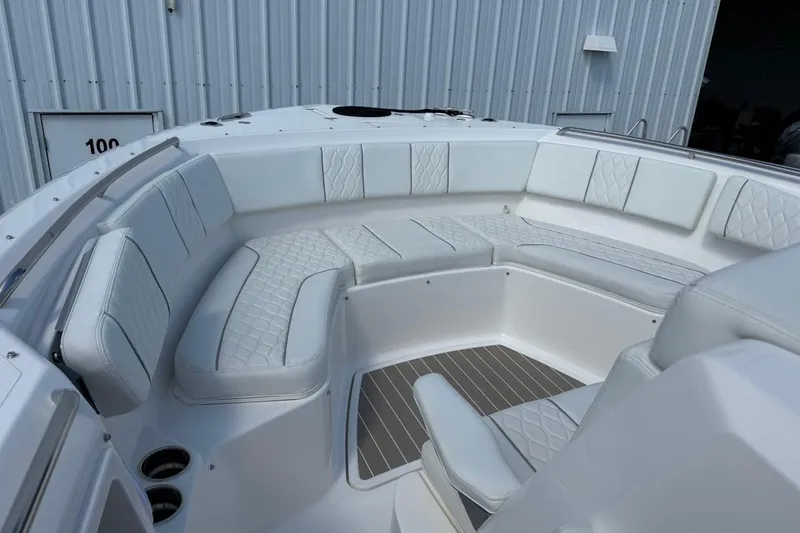 Slide: The Image of Luxurious seating area on the 2026 Pursuit S 358 Sport boat, featuring elegant white upholstery. - 39