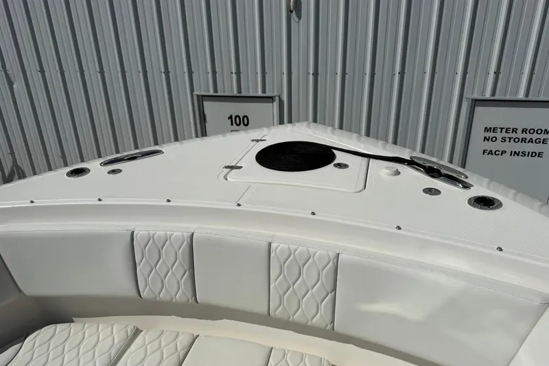 Slide: The Image of 2026 Pursuit S 358 Sport boat bow with quilted seating and storage compartments. - 41