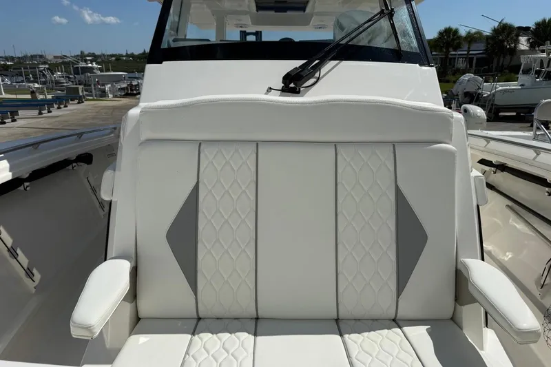Slide: The Image of 2026 Pursuit S 358 Sport boat with luxurious white seating and modern design. - 45