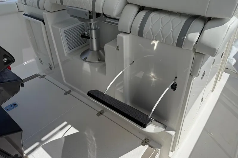 Slide: The Image of Interior of 2026 Pursuit S 358 Sport boat with seating and storage features. - 48