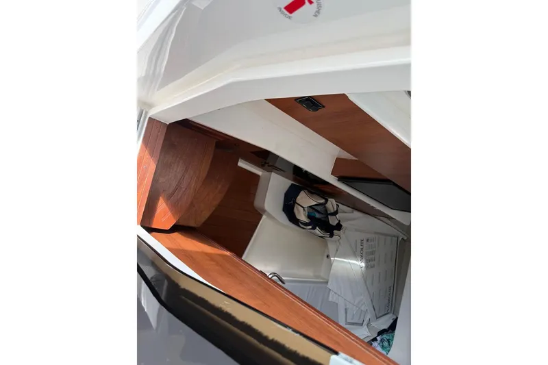 Slide: The Image of Interior cabin of 2026 Pursuit S 358 Sport boat with wooden accents and seating. - 49