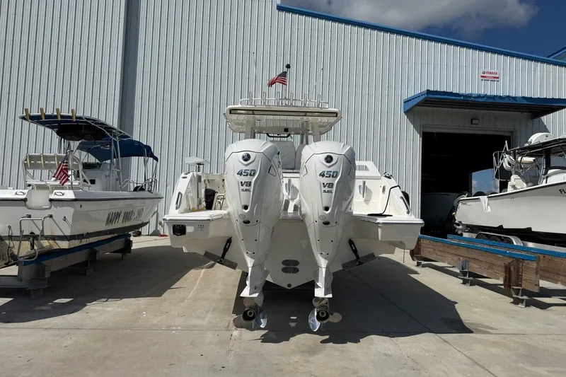Slide: The Image of 2026 Pursuit S 358 Sport boat with twin 450 V8 engines at a marina. - 5