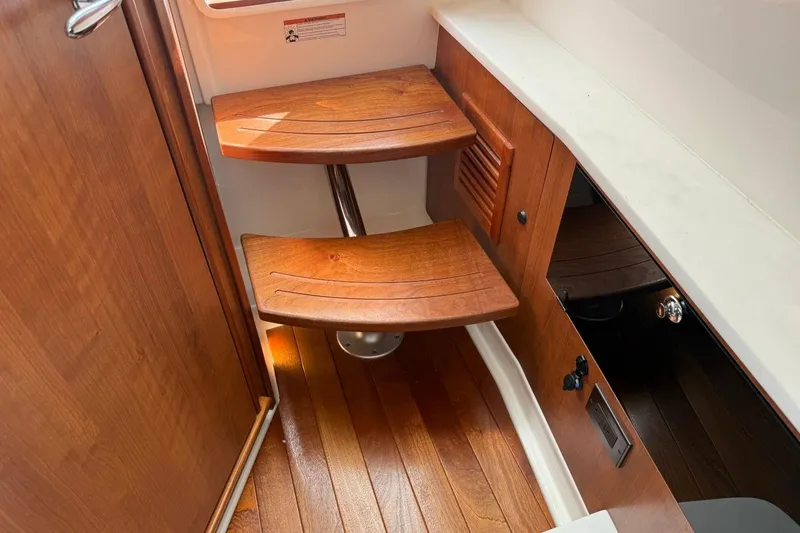 Slide: The Image of Interior wooden steps in 2026 Pursuit S 358 Sport boat cabin. - 50