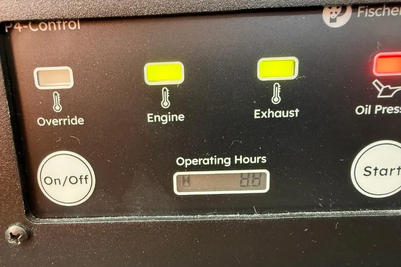 Slide: The Image of Control panel with indicators for engine, exhaust, oil pressure, and operating hours display. - 52