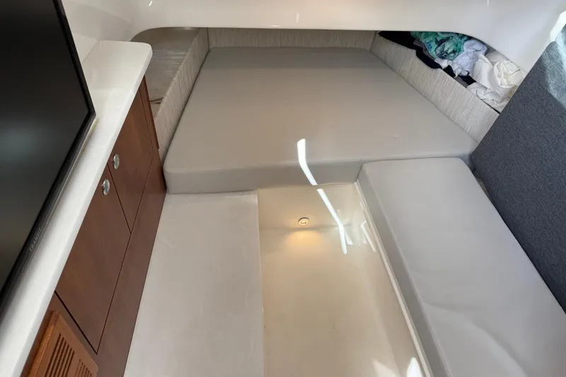 Slide: The Image of Interior cabin of 2026 Pursuit S 358 Sport boat with seating and storage. - 54