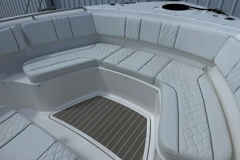 Slide: The Image of Luxurious seating area on the 2026 Pursuit S 358 Sport boat, featuring quilted upholstery. - 60