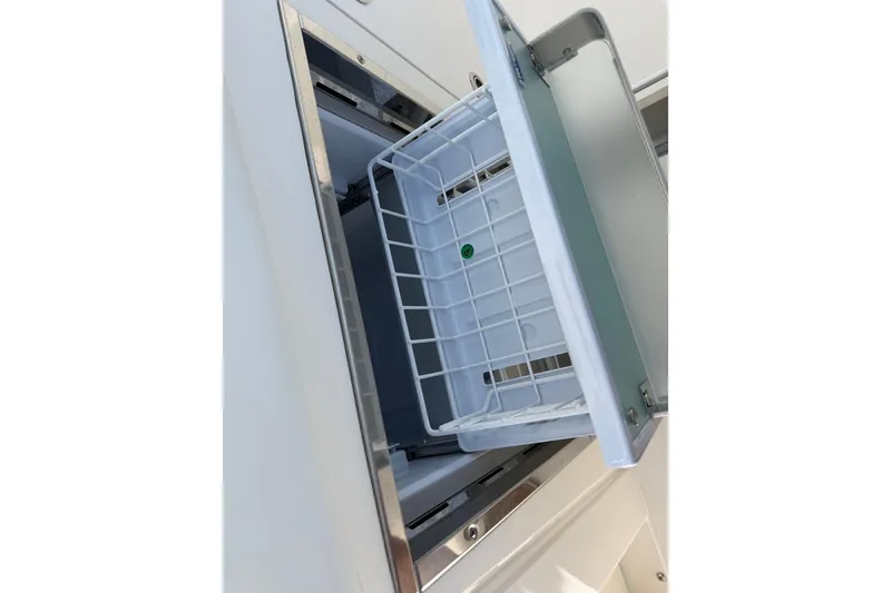 Slide: The Image of Open storage compartment on 2026 Pursuit S 358 Sport boat. - 62
