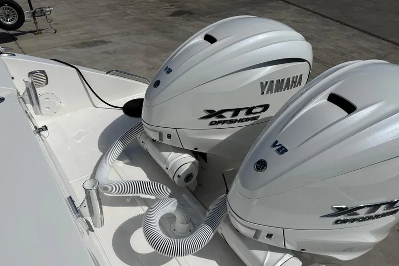 Slide: The Image of Twin Yamaha XTO Offshore V8 engines on a 2026 Pursuit S 358 Sport boat. - 9