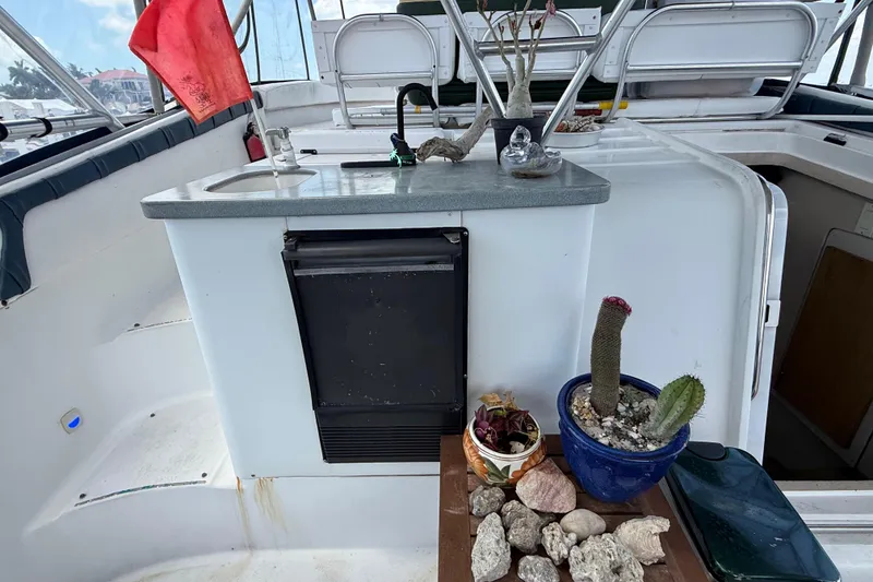 Slide: The Image of 1995 Mainship 37 Motor Yacht interior with sink, plants, and decorative stones. - 15