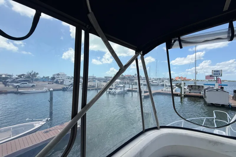 Slide: The Image of View from 1995 Mainship 37 Motor Yacht at marina with boats and fuel dock. - 16