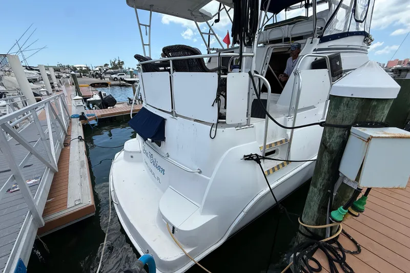 Slide: The Image of 1995 Mainship 37 Motor Yacht docked at marina, featuring spacious deck and modern design. - 4