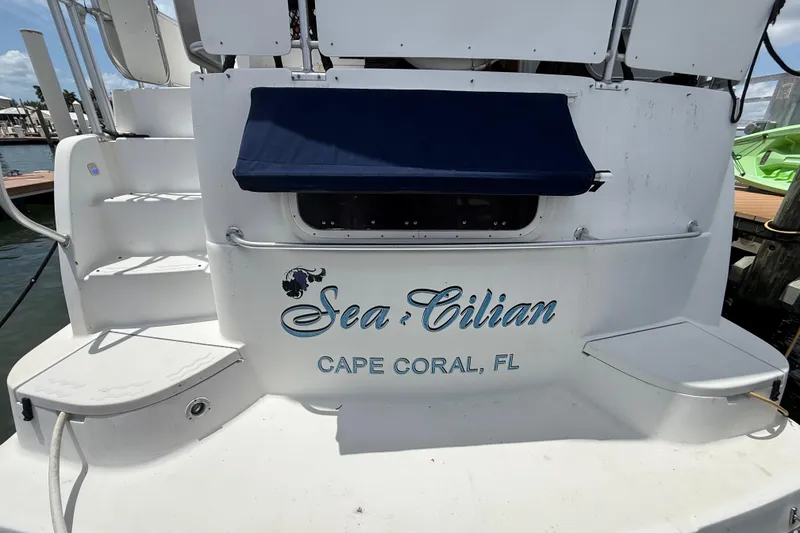 Slide: The Image of 1995 Mainship 37 Motor Yacht docked in Cape Coral, FL, featuring "Sea-Cilian" name. - 5