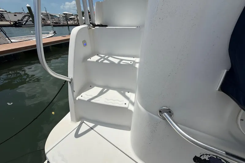 Slide: The Image of Staircase on 1995 Mainship 37 Motor Yacht, docked at marina. - 6