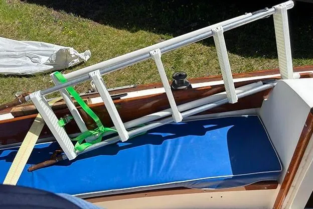 Slide: The Image of 1977 Cape Dory Typhoon Weekender with ladder and blue cushion on deck. - 10