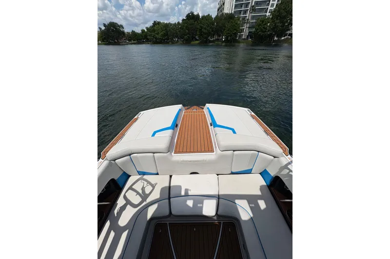 Slide: The Image of 2014 Nautique Super Air Nautique 210 boat interior with lake view. - 5