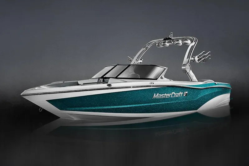Slide: The Image of Manufacturer Provided Image: 2018 MasterCraft XT23 boat with teal and white exterior. - 13