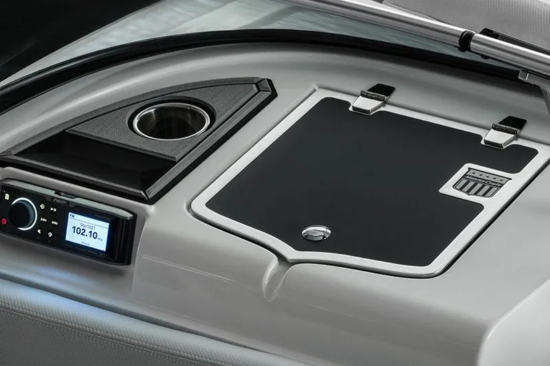 Slide: The Image of Manufacturer Provided Image: 2018 MasterCraft XT23 boat dashboard with control panel and cup holder. - 15