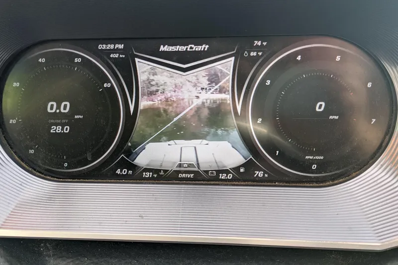 Slide: The Image of Dashboard of a 2018 MasterCraft XT23 boat displaying speed, RPM, and rear camera view. - 4