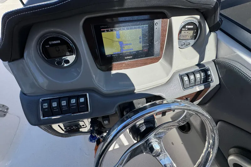 Slide: The Image of Dashboard of a 2018 Chaparral 250 Suncoast boat with Garmin navigation system. - 11
