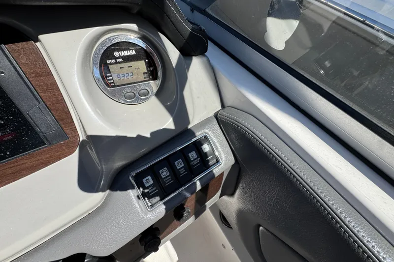 Slide: The Image of Dashboard of 2018 Chaparral 250 Suncoast boat with Yamaha gauge and control switches. - 13