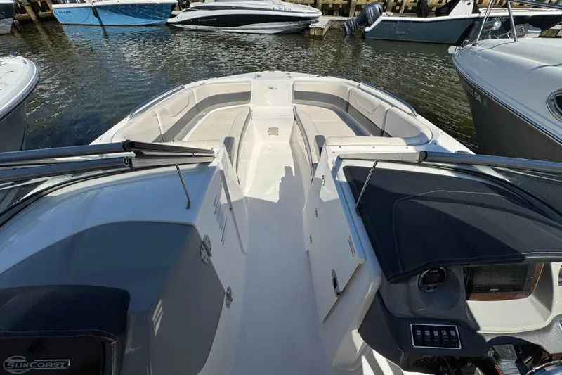 Slide: The Image of 2018 Chaparral 250 Suncoast boat interior, featuring spacious seating and modern dashboard controls. - 20