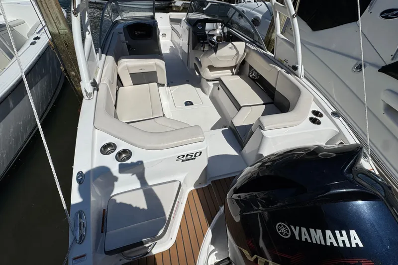 Slide: The Image of 2018 Chaparral 250 Suncoast boat with Yamaha engine, featuring spacious seating and sleek design. - 3
